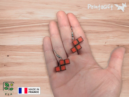 Boucle d'oreille d'inspiration brique rouge